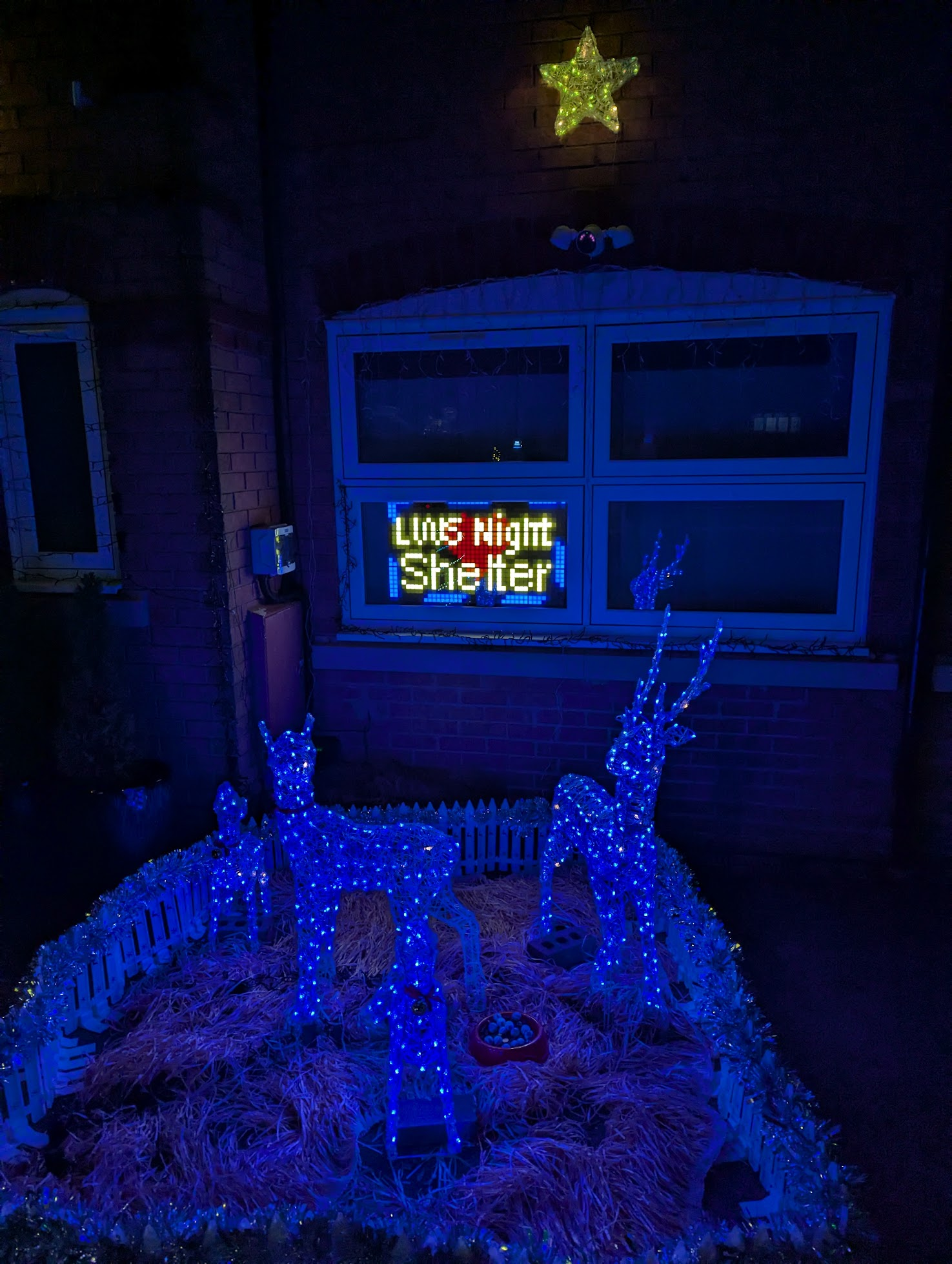 A still from the Thank You sequence showing a window that says "LWS Night Shelter". In full, it says "Thank You for your donation to LWS Night Shelter".